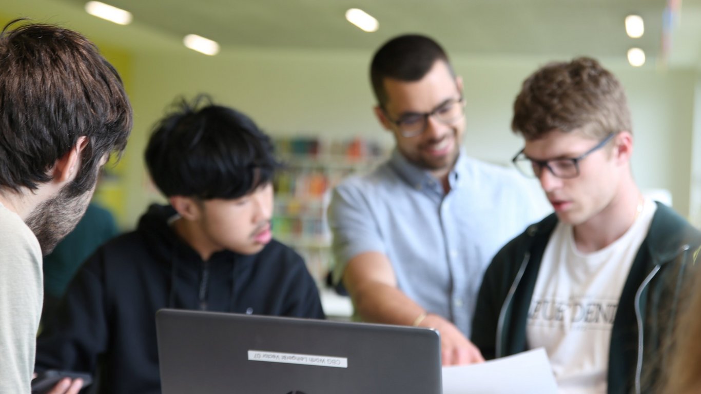 Dr. Jerôme Azzola with a group of students
