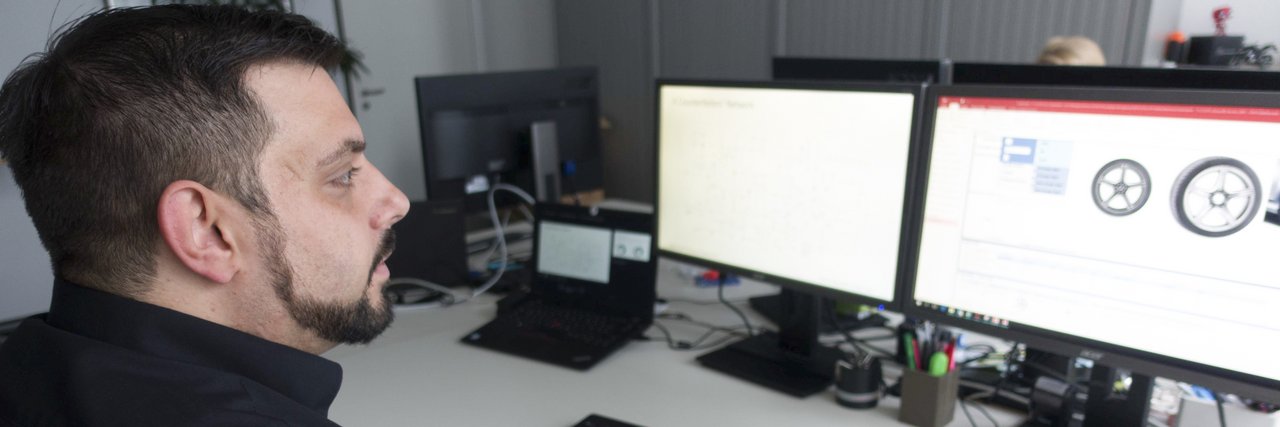 Sven Eric Widmeyer checks trade mark law details at his workplace.