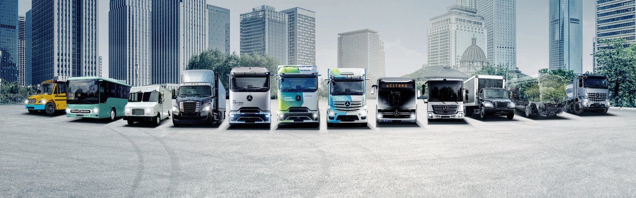 Daimler Truck Family Shot - Future Range emissionsfreie Fahrzeuge mit Hochhäusern im Hintergrund
