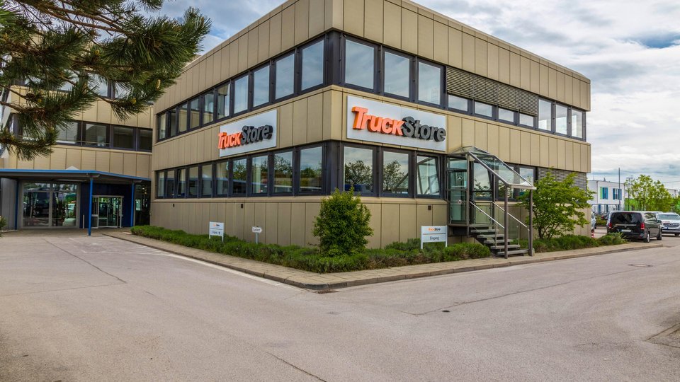 Exterior view of the TruckStore location in Munich with two-storey façade and company signage.