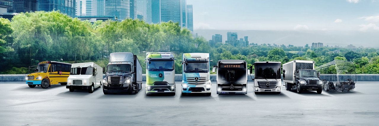 Daimler Truck Family Shot - Range zero emission vehicles with city in the background