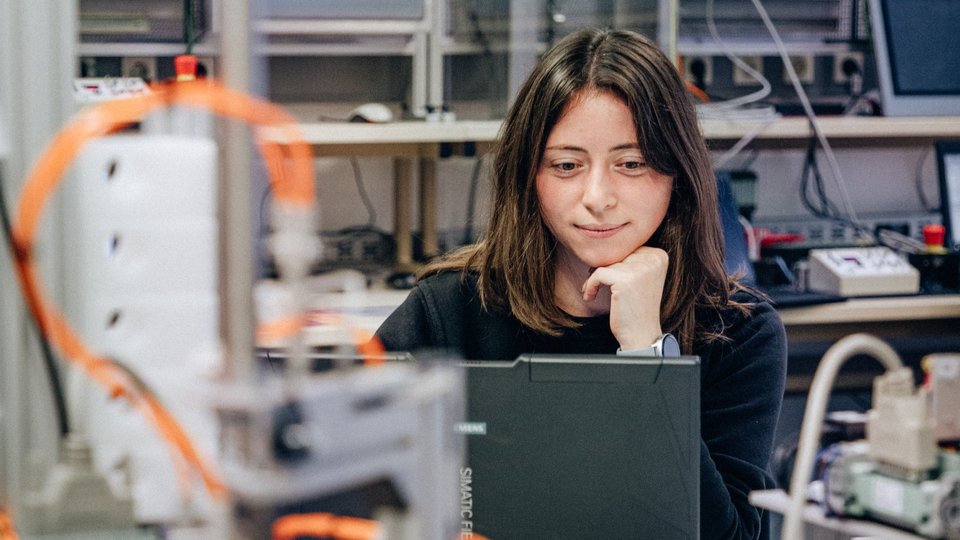 An employee works in a technical laboratory.
