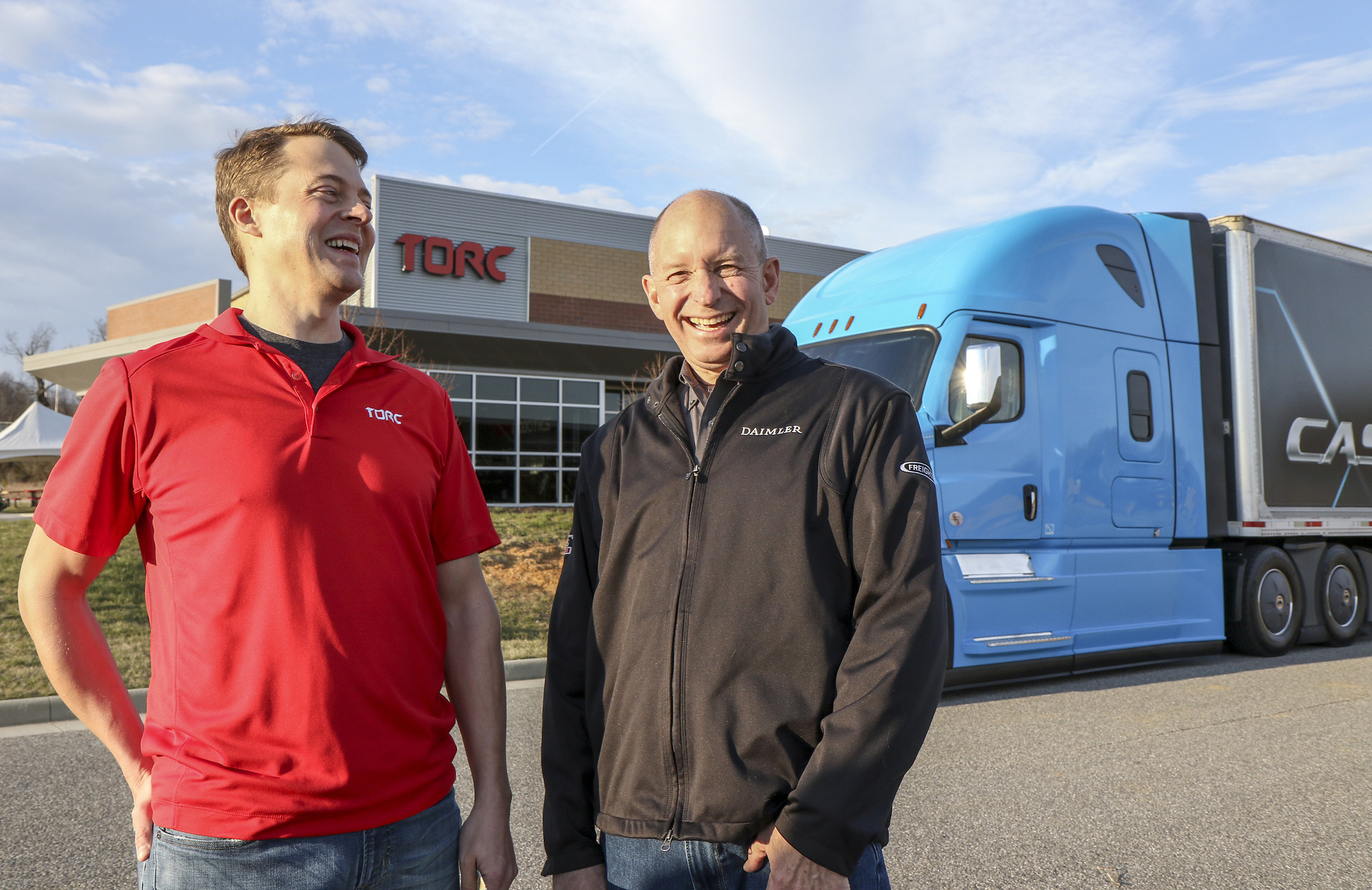 Michael Fleming, CEO of Torc Robotics, (left) and Roger Nielsen, CEO of Daimler Trucks North America LLC, in front of the Torc headquarters in Blacksburg, Virginia. Daimler Trucks agrees to acquire majority stake in Torc Robotics to create technology powerhouse for automated trucks