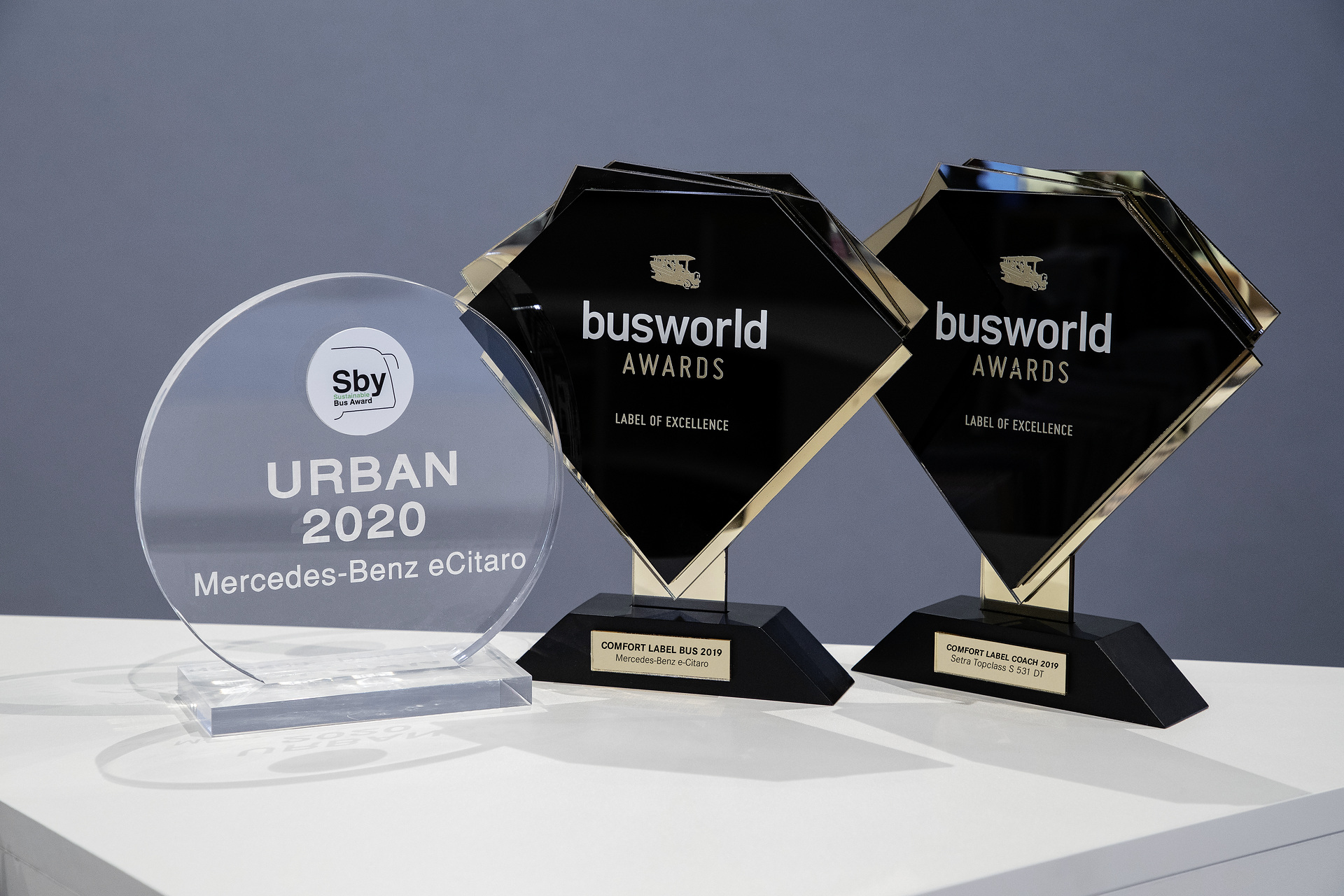 The “Sustainability Award” for Mercedes-Benz eCitaro and the Busworld “Comfort Labels 2019” for Mercedes-Benz eCitaro and Setra S 531 DT (from left to right). Daimler Buses „Busworld Europe“