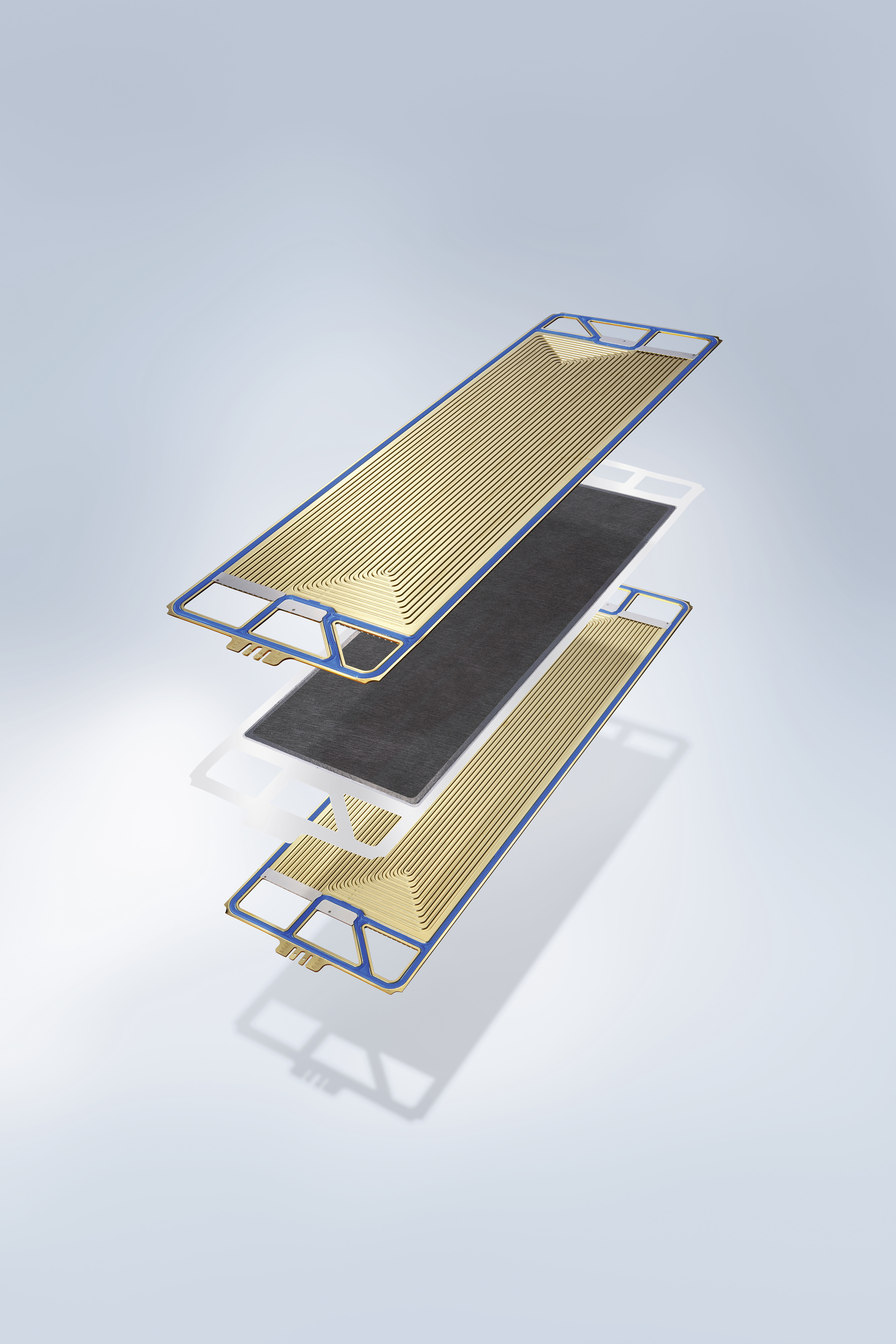The PEM fuel cell is structured like a sandwich. In the centre is a thin plastic film, the Proton Exchange Membrane (or PEM). This membrane is coated on both sides with a thin catalyst layer and a gas permeable electrode made of graphite paper. The membrane is surrounded by two so call ed bipolar plates into which gas ducts have been milled. Through these gas ducts flows hydrogen on the one side, and oxygen on the other. Several of these individual fuel cells can be stacked one behind the other to create a so-called fuel cell stack, thus forming a powerful energy source to drive the vehicle. Behind the scenes of fuel cell mobility