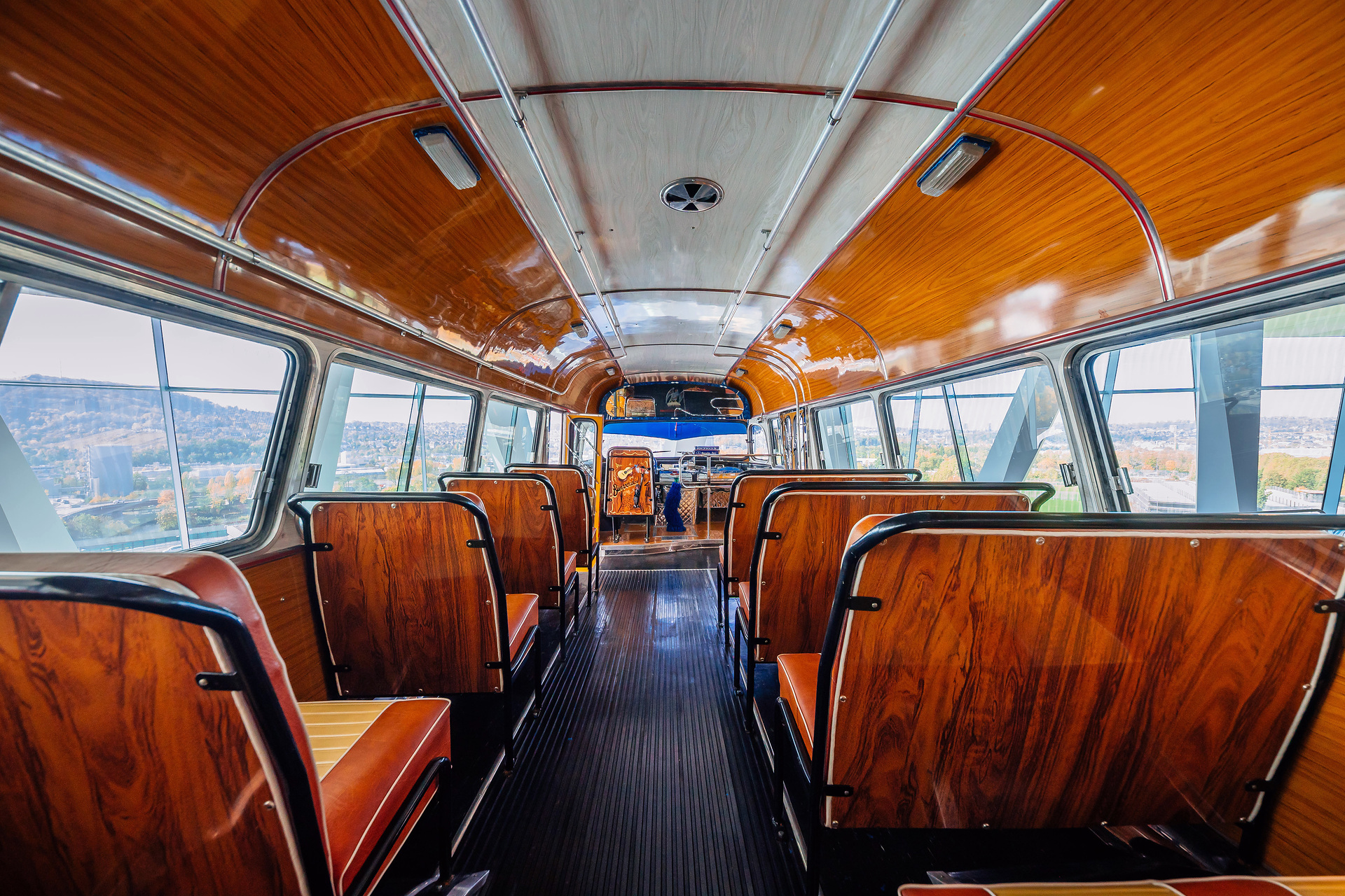 Mercedes-Benz Museum, Collection Room 1: Gallery of Voyagers. Mercedes-Benz LO 1112 bus from 1969. In Buenos Aires, Argentina, the richly decorated “colectivo” buses were an important part of local public transport for decades. View through the centre aisle to the front. What do a Mercedes-Benz bus and tango have in common?