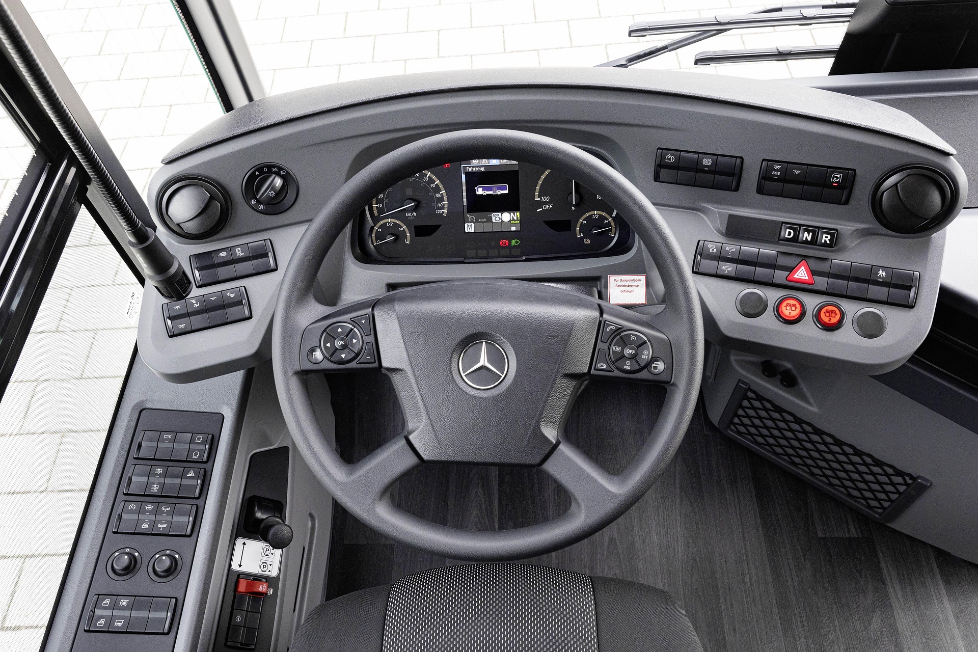 Mercedes-Benz eCitaro with all-electric drive, NMC 4 battery, interior, Seat covers: black with colorful stripes, 2 x electric hub motor, 2 x 140 kW, 2 x 495 Nm, 5 battery packs with 111 kWh each, LED headlamps, Sideguard Assist 2, Preventive Brake Assist 2, Frontguard Assist, Attention Assist, Traffic Sign Assist, 360 degree camera, length/width/height: 12135/2550/3400 mm, passenger capacity: 1/88. Mercedes-Benz, Daimler Buses Solutions and Omniplus in Hamburg: Daimler Buses at the UITP Summit 2025