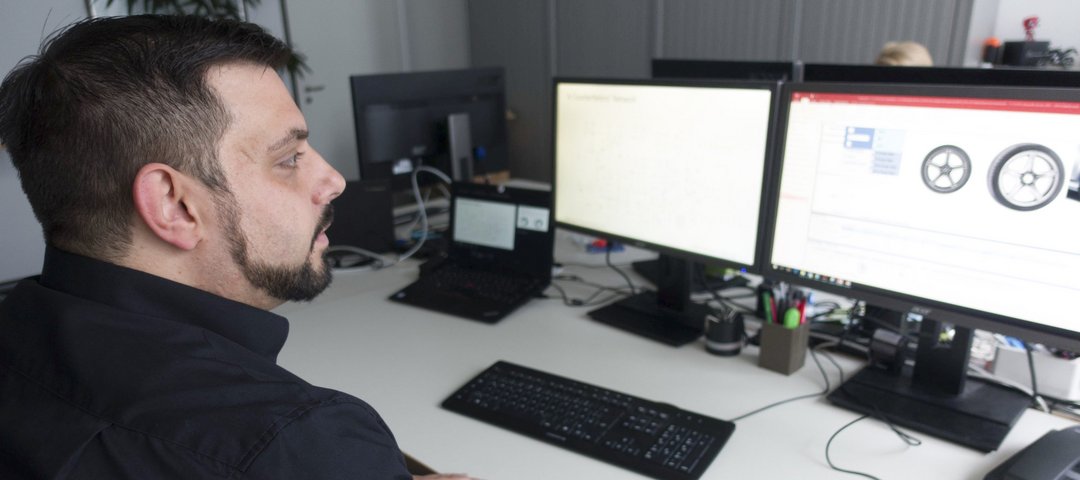 Sven Eric Widmeyer checks trade mark law details at his workplace.